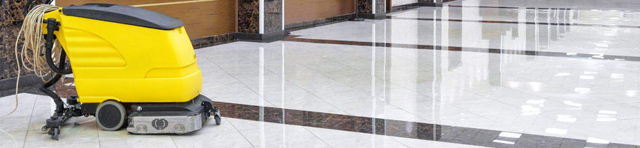 Banner is a photo of a large yellow buffing machine on the right side sitting atop a gleaming tile floor
