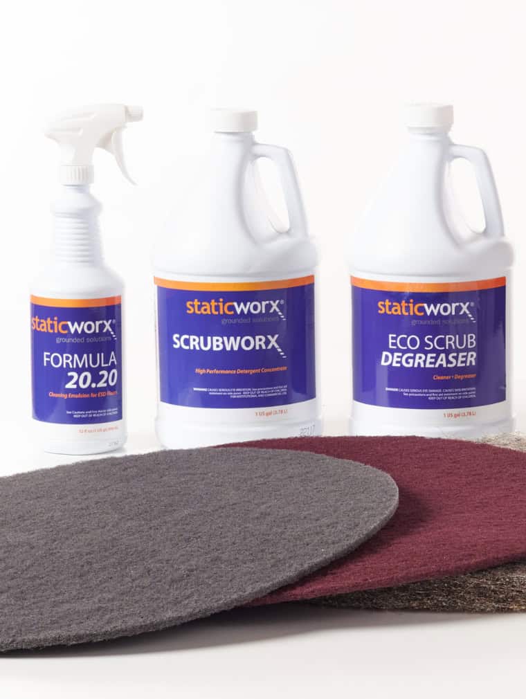 Photo of the StaticWorx range of cleaning products, including EcoScrub degreaser, ScrubWorx neutral pH cleaner, Formula 20.20 cleaning emulsion and gray, maroon and natural fiber scrubbing pads.